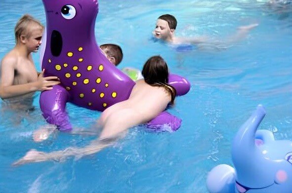 Indoor Waterside Day photo gallery - Nudists relax beautifully—a sight to behold