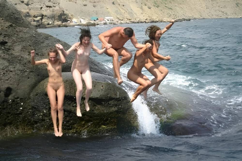 Mens and girls nudists on a beach - Naturism teaches us to accept ourselves and others without judgment