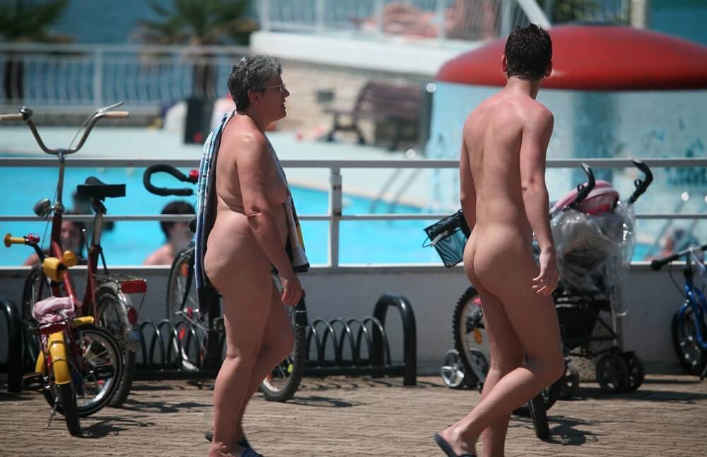 Sun-Soaked Sidewalk pics - Nudism strengthens health and self-esteem