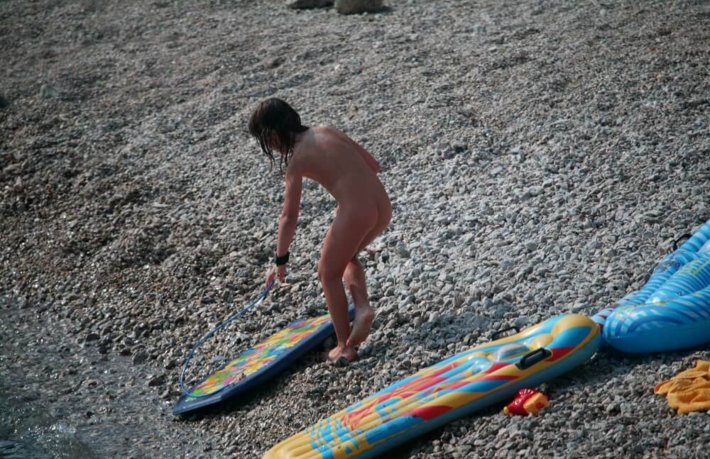 Naturist Surf Board Glides pics - Living in harmony with nature is the primary goal of the naturist and nudist lifestyle