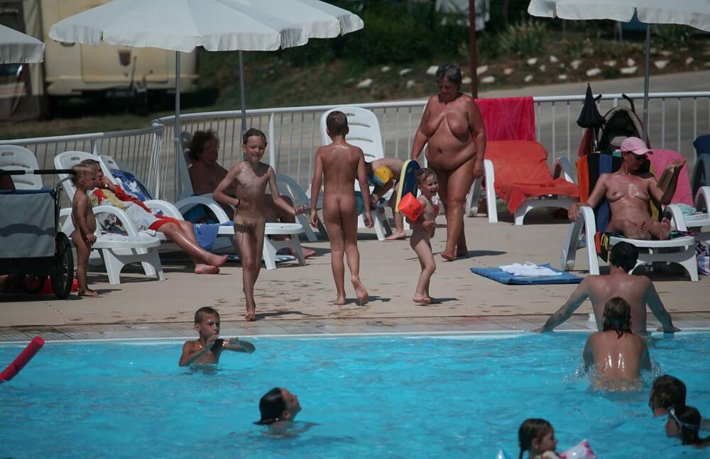 Naturist Afternoon Pool Games pics - Living freely and naturally is the dream of naturism and nudism advocates