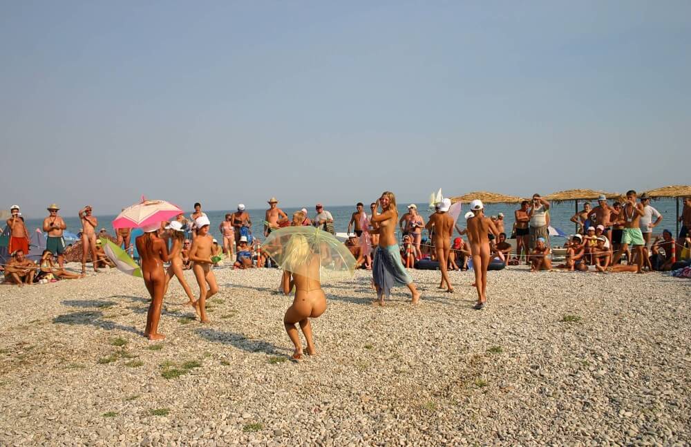 Ribbon and Umbrella Dance pics - People come together in unity with nature to take off their clothes