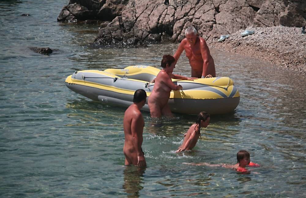 Lone Nudist in Yellow Boat photos - Naturists love openness and freedom