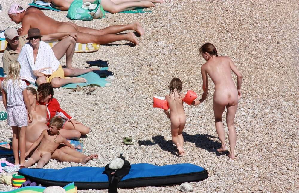 Orange Floaty Safety First Naturist pics - It values honesty and sincerity in trusting the nudists around you